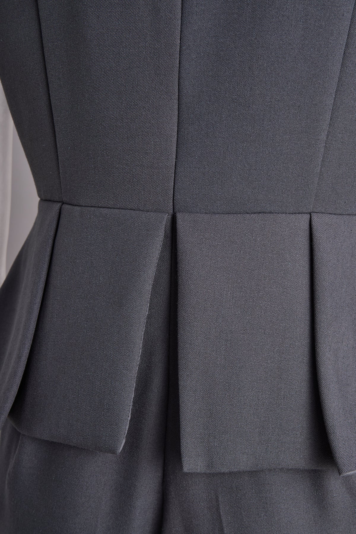 Sophisticated Sleeveless Peplum Jumpsuit In Charcoal Gray